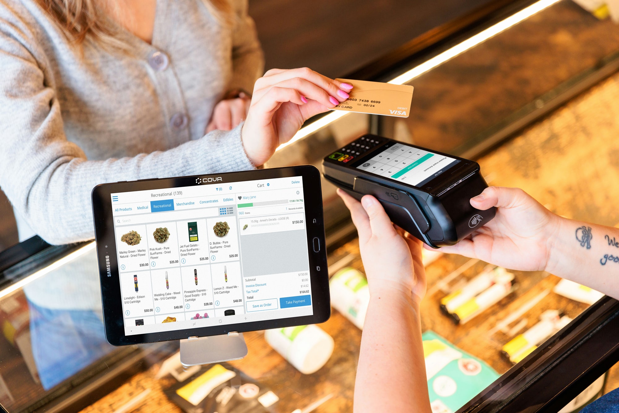 Professional cannabis retail consultation at a dispensary counter